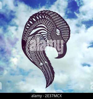 Animal figurines carved from paper in a photo of the sky. Paper-cut eagle figurine against the sky. Stock Photo