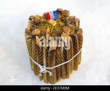 Stack of Solen marginatus, common name "grooved razor shell" (Italian: cannolicchio),sold at market on ice, seafood. Stock Photo