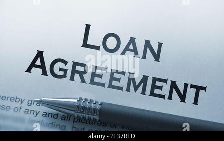 Loan Agreement word printed on page and luxury pen, business concept. Stock Photo