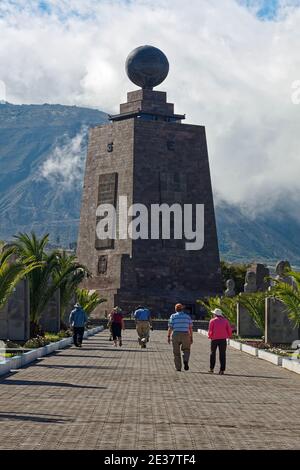 Monument to the Equator, 1982, La Mitad del Mundo, 98 feet, 30 meters, polished stone exterior, people, originally thought to be 0 latitude, cloudy sk Stock Photo