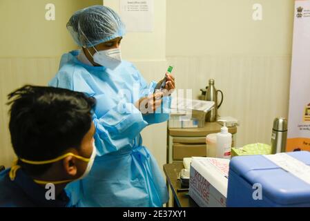 New Delhi, India. 16th Jan, 2021. A healthcare worker fills a syringe with a dose of a Oxford-AstraZeneca's COVID-19 vaccine- called COVISHIELD, during the coronavirus disease (COVID-19) vaccination campaign at Primus Super specialty Hospital hospital in New Delhi, India, January 16, 2021. Prime Minister Narendra Modi Saturday launched India's Covid-19 vaccination drive, the world's largest inoculation exercise against the novel coronavirus. In a virtual address, PM Modi paid tribute to scientists and healthcare workers, who have been on the frontlines of the pandemic. (Credit Image: © Stock Photo