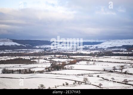 Great Broughton, North Yorkshire Moors , UK. Monday 4th January 2021:   The view of a wintery snowy looking Roseberry Topping in North Yorkshire this Stock Photo