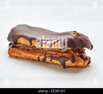 freshly baked eclair on white background Stock Photo