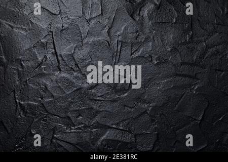 Black or dark gray art plastered wall texture background Stock Photo
