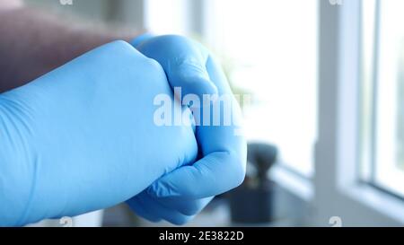 Image with Doctor Hands Wearing Surgical Gloves Needed in Protection Against Coronavirus Contamination Stock Photo