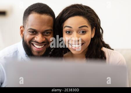Black couple having video call using laptop Stock Photo