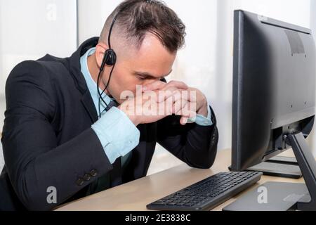 Business people wearing headset feel unhappy working in office . Failure negative sadness emotion concept of call center, telemarketing and customer Stock Photo