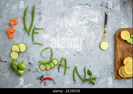 Vegetable Vegan word on grunge abstract background Stock Photo