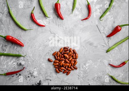 Beans and red pepper isolated on grunge background Stock Photo