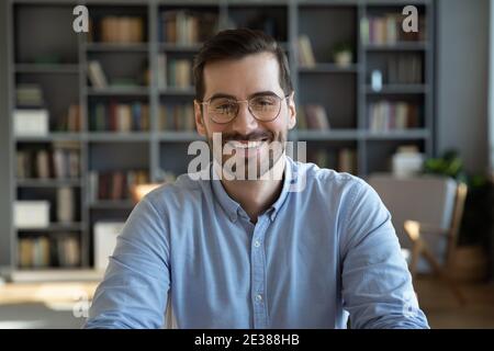Portrait of happy young handsome confident man in eyeglasses. Stock Photo