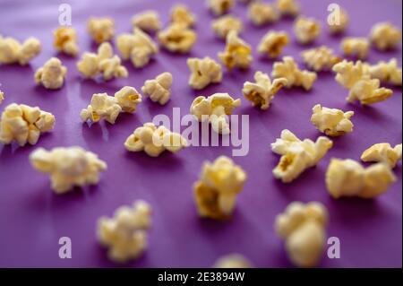 Popcorn closeup isolated on purple background Stock Photo