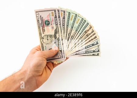 Hand with money isolated on a white background. US dollar bills Stock Photo