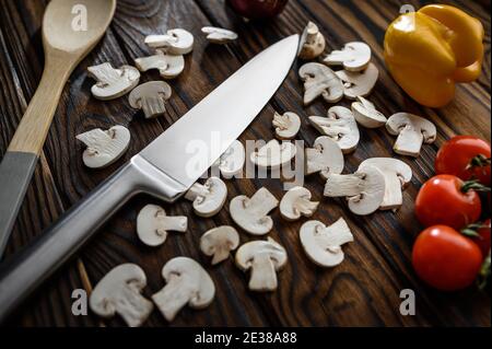Fresh cutted mushrooms, wooden background Stock Photo