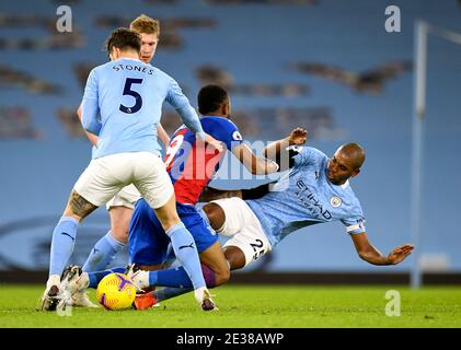 Manchester City's Fernandinho (right) fouls Crystal Palace's Jordan Ayew during the Premier League match at the Etihad Stadium, Manchester. Stock Photo