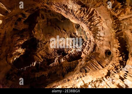 Illuminated picturesque karst rock formations in Balcarka Cave, Moravian Karst, Czech: Moravsky Kras, Czech Republic. Stock Photo