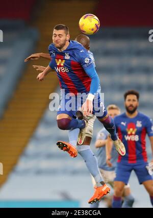 Crystal Palace's Joel Ward (left) and Manchester City's Fernandinho battle for the ball during the Premier League match at the Etihad Stadium, Manchester. Stock Photo