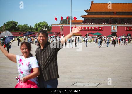 BEIJING, CHINA - AUGUST 24th 2017; Couple is posing for a photograph on Tian An Men square in front of The Gate of heavenly peace (entrace to Forbidde Stock Photo