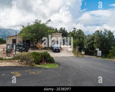 Urzulei, Nuoro, Sardinia, Italy, September 11, 2020: View of tourist info Gola Su Gorropu base camp at mountain pass Genna Silana, start of famous hik Stock Photo