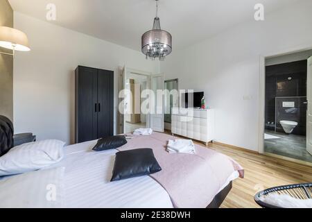 interior of  the modern bedroom apartment, bathroom in backgroud Stock Photo