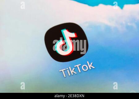 A closeup of the app logo for the Chinese TikTok video sharing social media networking service on a mobile phone smartphone screen Stock Photo