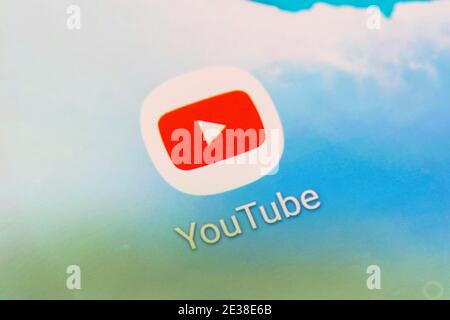 A closeup of the app logo for the American online video-sharing platform YouTube, a Google subsidiary, on a smartphone screen Stock Photo