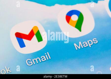 A closeup of the Gmail and Maps app logos by Google on a smartphone screen Stock Photo