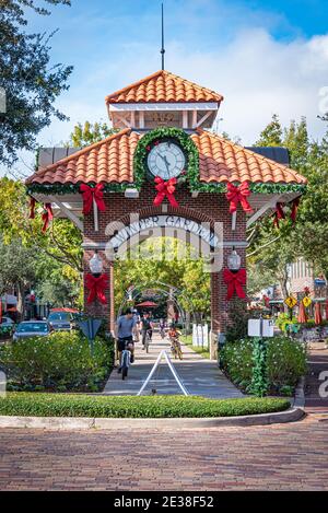 Family enjoying a bike ride together on the West Orange Trail through the center of Historic Downtown Winter Garden, Florida. (USA) Stock Photo