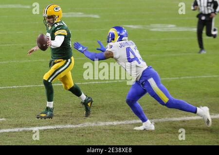 Los Angeles Rams quarterback John Wolford, front, is tackled by Seattle  Seahawks linebacker Uchenna Nwosu, bottom, as Seattle linebacker Bruce  Irvin, top, watches during the second half of an NFL football game