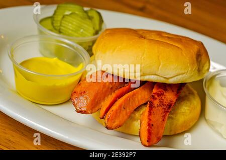 A hotdog sandwich is served on a bun at Martha's Menu, March 25, 2012, in Corinth, Mississippi. The sandwich consists of split, fried weiners on a bun. Stock Photo