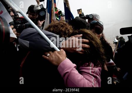 Miners relatives are pictured just at the moment after the new that T130 brake to the galery where the miners are in San Jose mine near Copaipo city, Chile, on October 9, 2010. Relative of the 33 miners trapped deep underground in a copper and gold mine is hugged after the T 130 drilling machine completed an escape hole for the 33 miners that are trapped deep underground at San Jose mine. Photo by Lorenzo Moscia/ABACAPRESS.COM Stock Photo