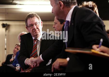 Danish president of the Party of European Socialists (PES) Poul Nyrup Rasmussen shakes hands to French Socialist deputy and former French Prime minister Laurent Fabius during Socialist Party National Convention at La Defense, near Paris, France on October 9, 2010. Photo by Stephane Lemouton/ABACAPRESS.COM Stock Photo