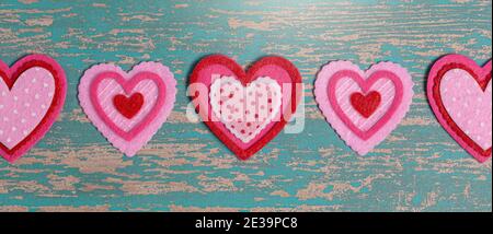 Simple Background with Felt Love Hearts on a Wooden Table Stock Photo