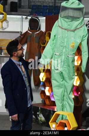 Damascus, Syria. 17th Jan, 2021. A man attends an exhibition showcasing various types of locally-made honey and equipment for honey makers in Damascus, Syria, on Jan. 17, 2021. Credit: Ammar Safarjalani/Xinhua/Alamy Live News Stock Photo