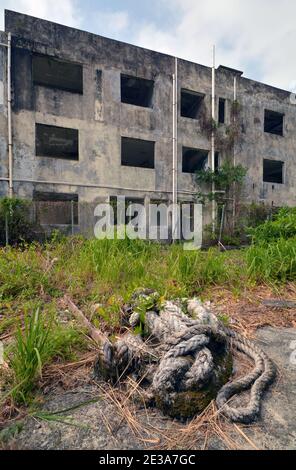 MaWan ghost village in Hong Kong, abandoned and forgotten buildings after a new bridge was built over the island. Homes just left to the elements. Stock Photo