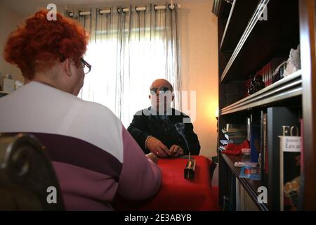 EXCLUSIVE. Orabraius, the blind seer, is pictured making his predictions through a tarot card set marked in Braille, in Thuir, near Perpignan, southern France on November 18, 2010. Medium Orabraius imaginated and created himself these cards which are unique in the world. Using a stiletto and a pierced tablet, he holed the cards with each a different code he is able to 'read' with his fingers. Hundreds of known and unknown people consult the medium, most of them anonymously. Photo by Michel Clementz/ABACAPRESS.COM Stock Photo