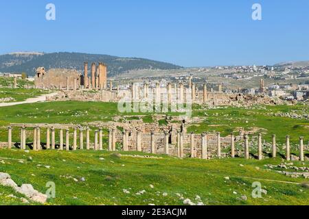 Columns of anciet roman and byzantine city of Jerash in Jordan. Multiple columns preserved at touristic site in Old Gerasa. Stock Photo