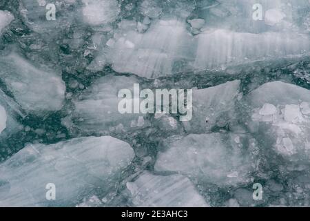 https://l450v.alamy.com/450v/2e3ahc3/big-pieces-of-ice-swimming-in-water-2e3ahc3.jpg