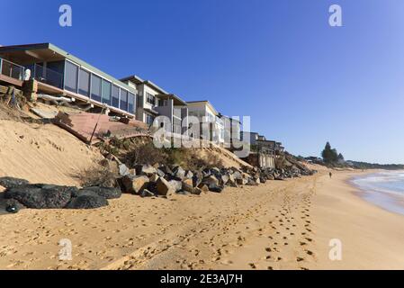 Beach erosion causing damage to waterfront houses at Wamberal Beach near Terrigal on the Central Coast of NSW Australia Stock Photo