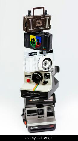 stack of older traditional analogue / film cameras of various types Stock Photo