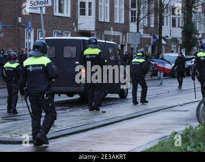 Anti-riot police officers intervened against anti-lockdown protestors during demonstration at the Museumplein amid the coronavirus pandemic on January