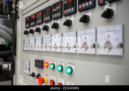 Electrical control panel and digital temperature control of plastic film making machine to produce bags. Stock Photo
