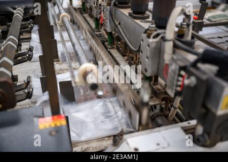 Shopping bag making machine with heat seal and high speed bags are working. It's used for a long time and it has old condition. In the concept of Save Stock Photo