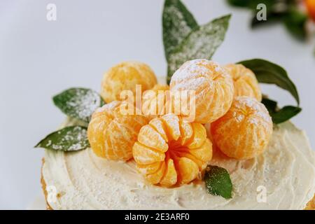 Orange tangerines with green leaves close up. Stock Photo