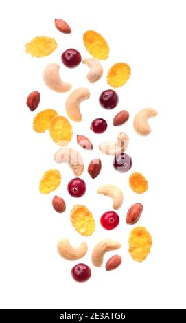 Breakfast. Falling berries with nuts and corn flax isolated on white backgrounds. Stock Photo