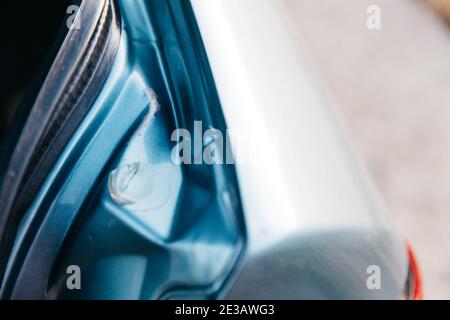 Car body damage, dents and scratches on the car. Stock Photo