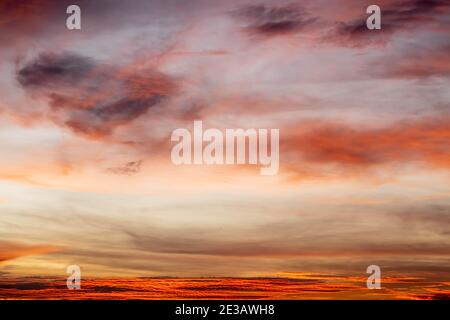Sunset Orange color cloudy Sky Background In The Evening time. Stock Photo