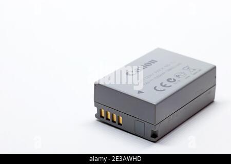 Umea, Norrland Sweden - January 7, 2021: gray battery for camera on white background Stock Photo