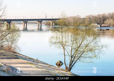 Fragment of Rusanovsky Bay of the Dnieper River in Kiev, Ukraine. View of the Paton Bridge. Stock Photo
