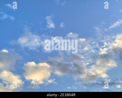Blue sky and some small white clouds in the afternoon Stock Photo