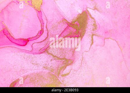 Alcohol ink pink and gold abstract stains background. Drops watercolor transparent texture Stock Photo